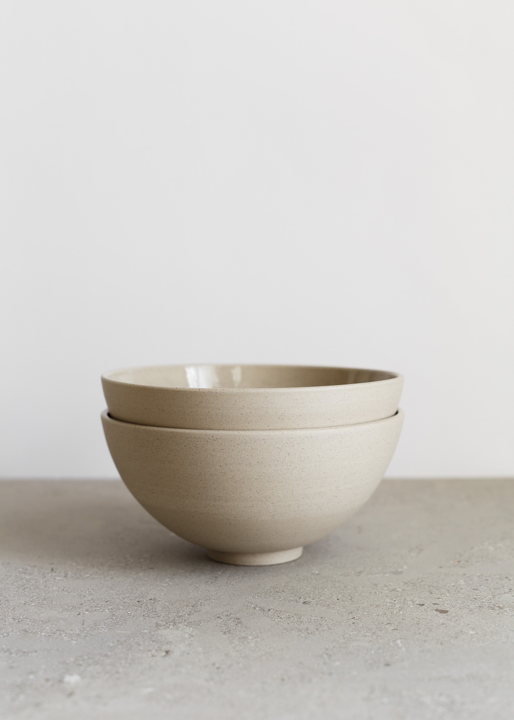 Stack of sand coloured bowls