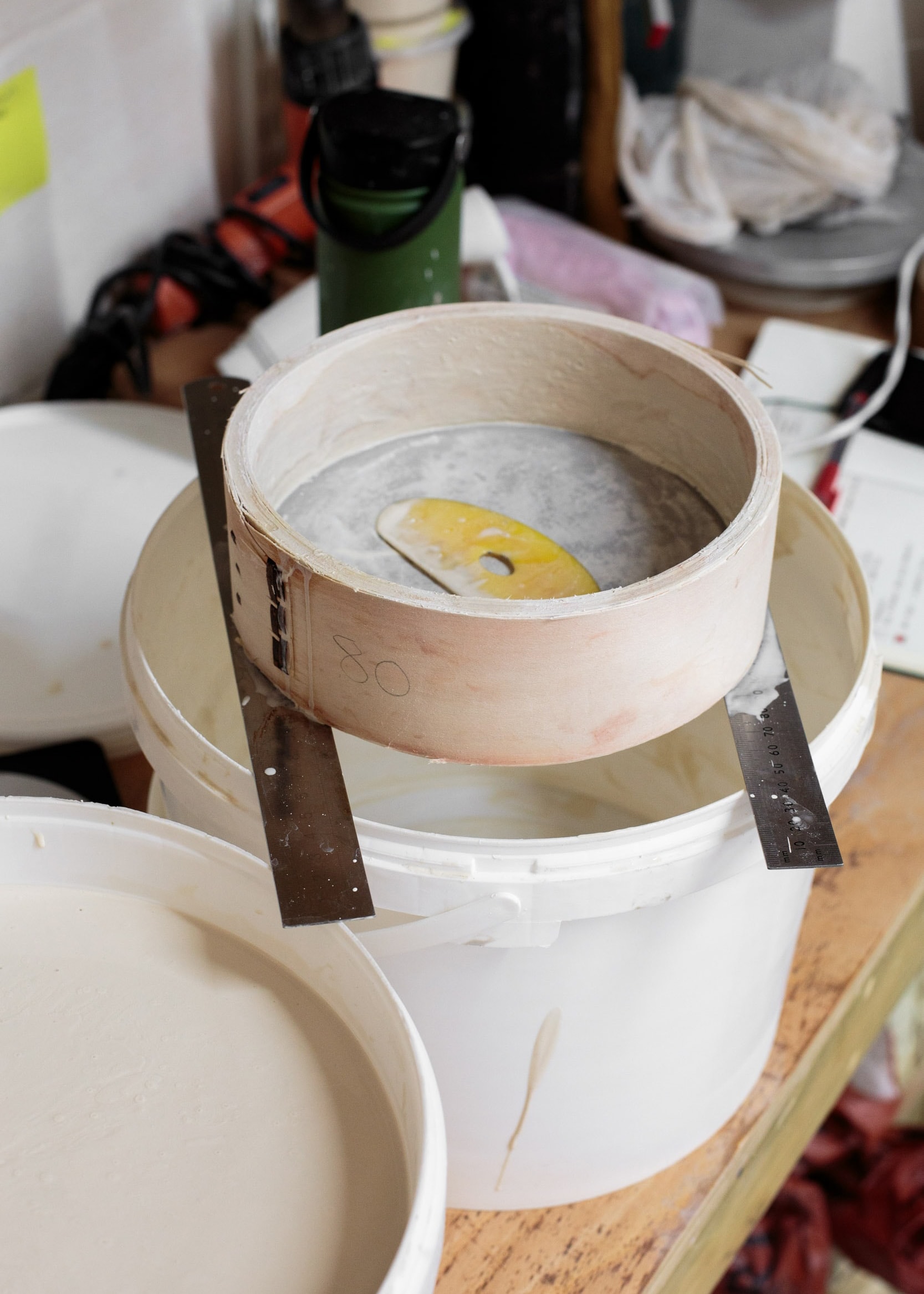 GLaze sieve over a white bucket