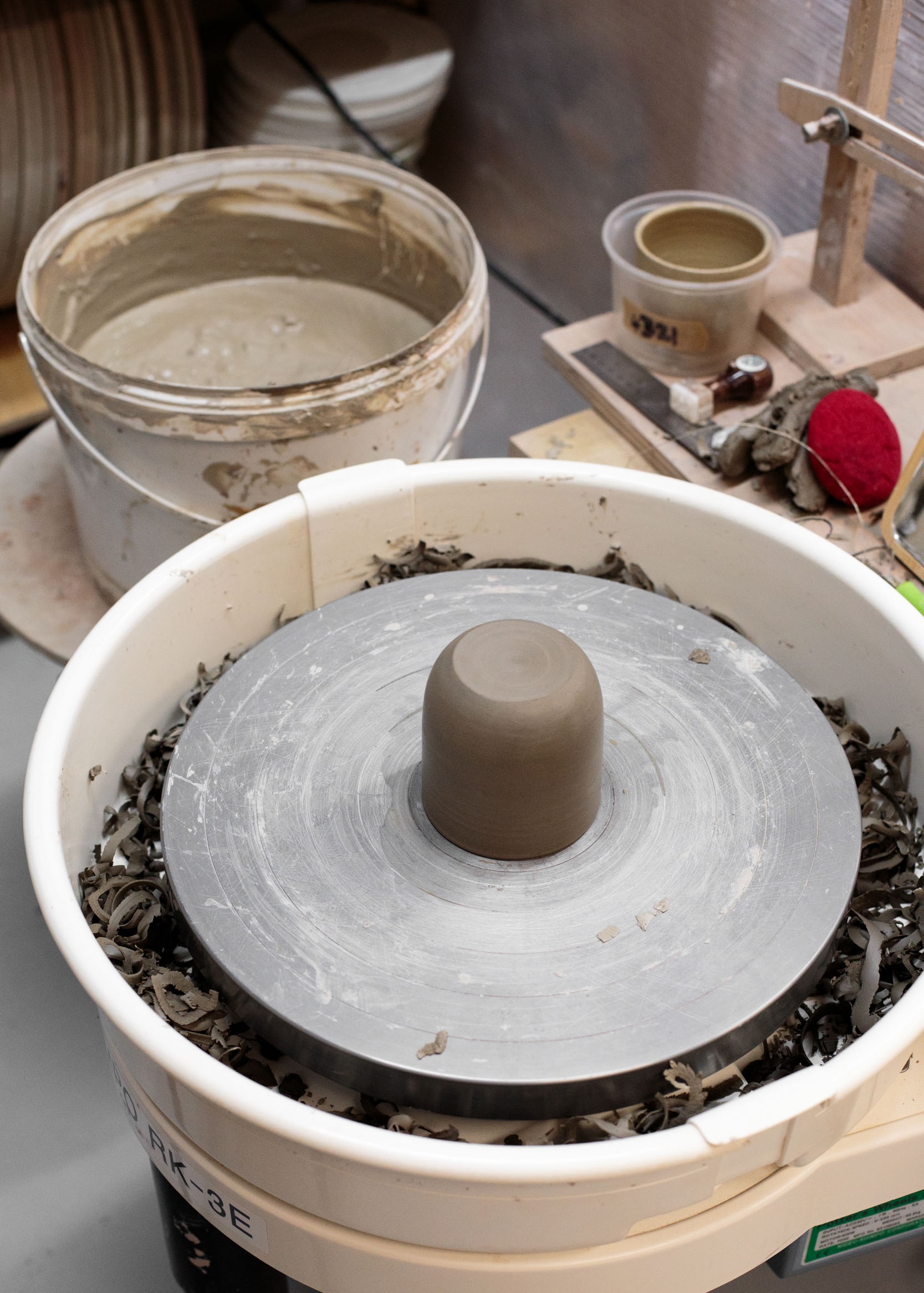 Trimmed cup on a pottery wheel